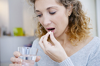 Patient takes pre-medication for Endodontist Drs. Moretton or Vail in Fishers prior to treatment being performed by Endodontic Specialists